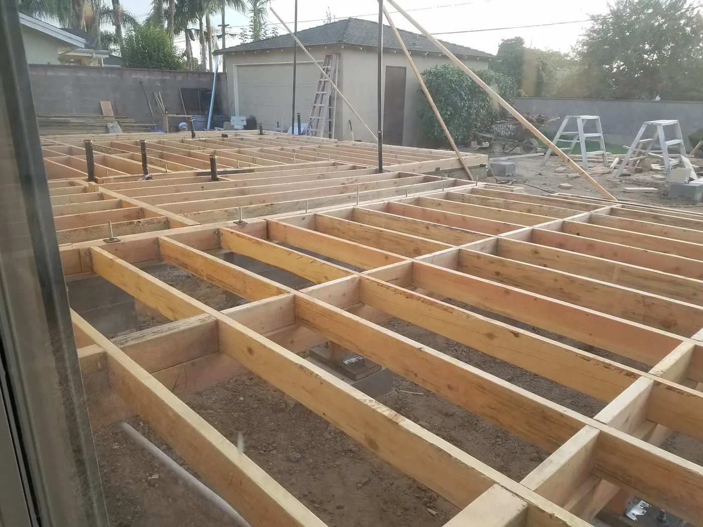 Foundation and floor framing phase at the West Covina residence