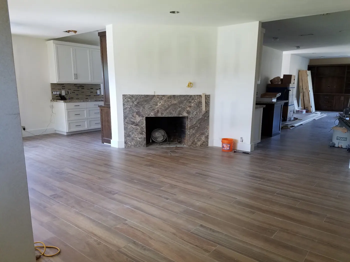 Open living area with new flooring in the West Covina residence